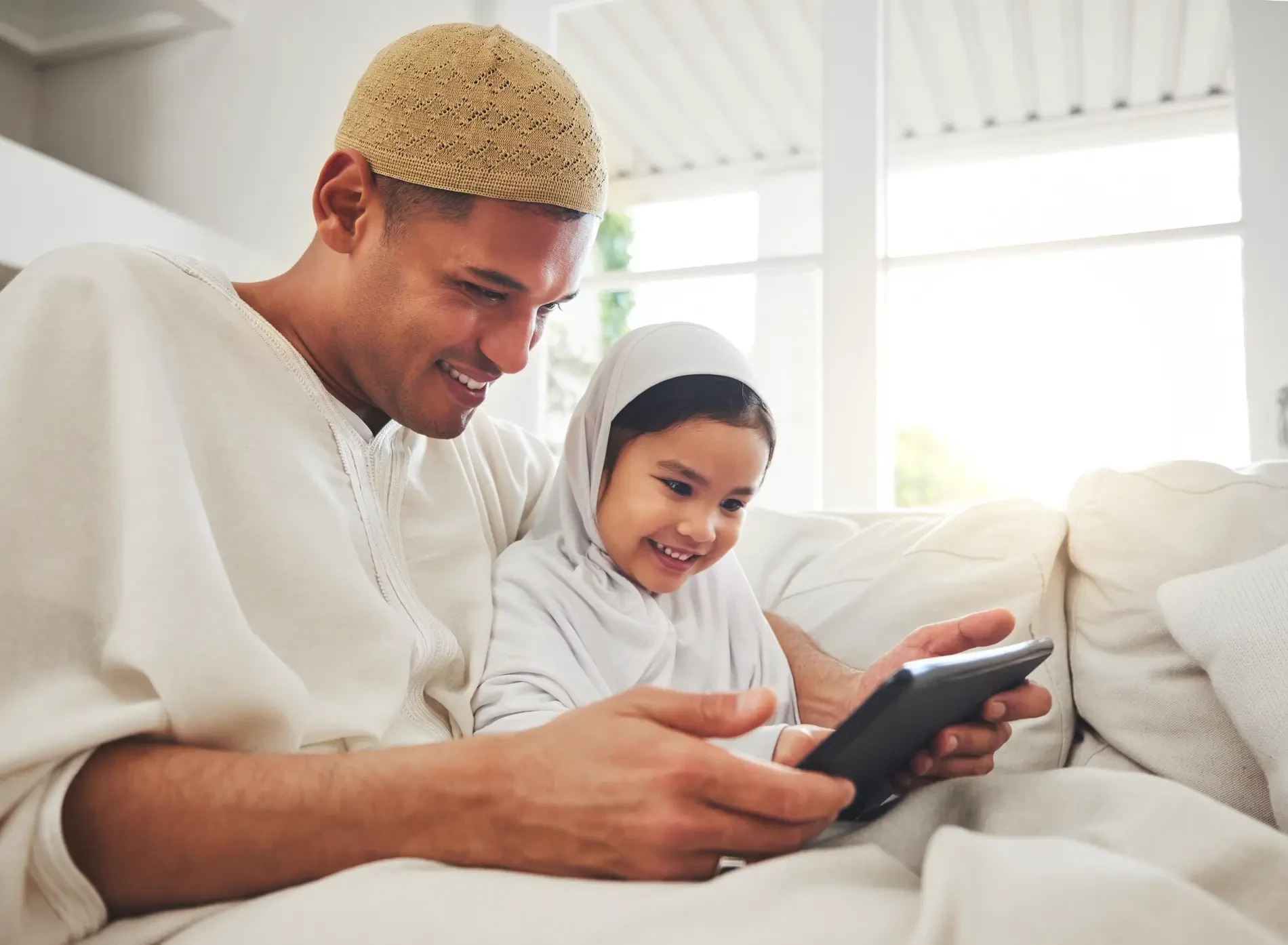 Family Father with his kid reading quran